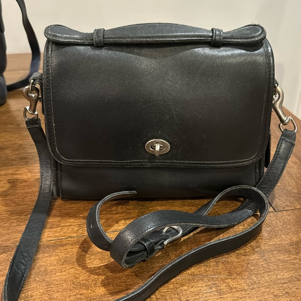 Coach black leather cross body vintage with silver button.